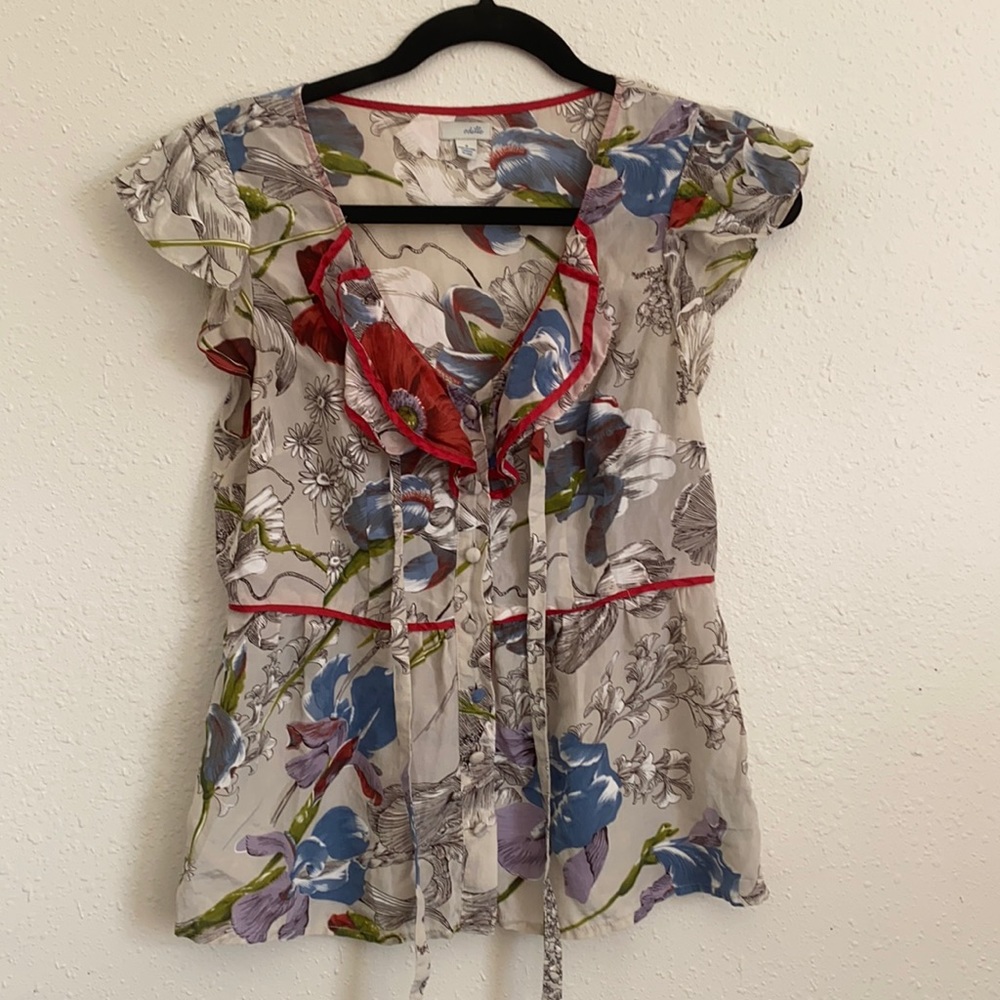 Odille floral cap sleeve button down blouse.